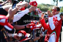 Sebastian Vettel (GER) Ferrari signs autographs for the fans. 20.03.2016. Formula 1 World Championship, Rd 1, Australian Grand Prix, Albert Park, Melbourne, Australia, Race Day.