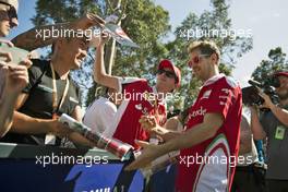 Sebastian Vettel (GER) Ferrari signs autographs for the fans. 17.03.2016. Formula 1 World Championship, Rd 1, Australian Grand Prix, Albert Park, Melbourne, Australia, Preparation Day.