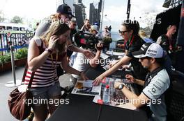 Sergio Perez (MEX) Sahara Force India F1 signs autographs for the fans. 17.03.2016. Formula 1 World Championship, Rd 1, Australian Grand Prix, Albert Park, Melbourne, Australia, Preparation Day.