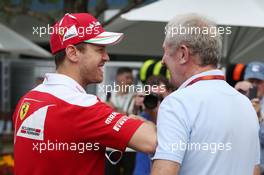(L to R): Sebastian Vettel (GER) Ferrari with Dr Helmut Marko (AUT) Red Bull Motorsport Consultant. 17.03.2016. Formula 1 World Championship, Rd 1, Australian Grand Prix, Albert Park, Melbourne, Australia, Preparation Day.