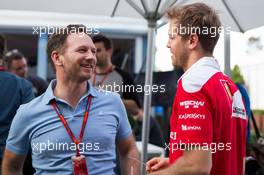 (L to R): Christian Horner (GBR) Red Bull Racing Team Principal with Sebastian Vettel (GER) Ferrari. 17.03.2016. Formula 1 World Championship, Rd 1, Australian Grand Prix, Albert Park, Melbourne, Australia, Preparation Day.