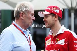 (L to R): Dr Helmut Marko (AUT) Red Bull Motorsport Consultant with Sebastian Vettel (GER) Ferrari. 17.03.2016. Formula 1 World Championship, Rd 1, Australian Grand Prix, Albert Park, Melbourne, Australia, Preparation Day.