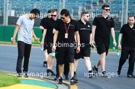 Rio Haryanto (IDN) Manor Racing walks the circuit with the team. 16.03.2016. Formula 1 World Championship, Rd 1, Australian Grand Prix, Albert Park, Melbourne, Australia, Preparation Day.