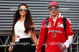 Kimi Raikkonen (FIN) Ferrari with his wife Minttu Virtanen (FIN). 01.07.2016. Formula 1 World Championship, Rd 9, Austrian Grand Prix, Spielberg, Austria, Practice Day.