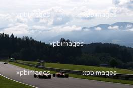 Kevin Magnussen (DEN), Renault Sport F1 Team adKimi Raikkonen (FIN), Scuderia Ferrari  01.07.2016. Formula 1 World Championship, Rd 9, Austrian Grand Prix, Spielberg, Austria, Practice Day.