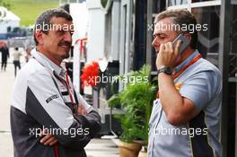 (L to R): Guenther Steiner (ITA) Haas F1 Team Prinicipal with Mario Isola (ITA) Pirelli Racing Manager. 01.07.2016. Formula 1 World Championship, Rd 9, Austrian Grand Prix, Spielberg, Austria, Practice Day.
