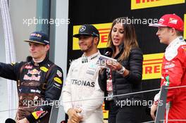 The podium (L to R): Max Verstappen (NLD) Red Bull Racing, second; Lewis Hamilton (GBR) Mercedes AMG F1, race winner; Noemi de Miguel (ESP) TV Presenter; Kimi Raikkonen (FIN) Ferrari, third. 03.07.2016. Formula 1 World Championship, Rd 9, Austrian Grand Prix, Spielberg, Austria, Race Day.