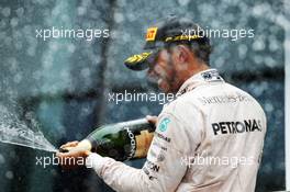 Race winner Lewis Hamilton (GBR) Mercedes AMG F1 celebrates on the podium. 03.07.2016. Formula 1 World Championship, Rd 9, Austrian Grand Prix, Spielberg, Austria, Race Day.