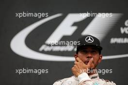 Race winner Lewis Hamilton (GBR) Mercedes AMG F1 celebrates on the podium. 03.07.2016. Formula 1 World Championship, Rd 9, Austrian Grand Prix, Spielberg, Austria, Race Day.