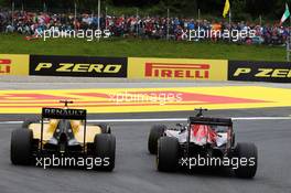 (L to R): Jolyon Palmer (GBR) Renault Sport F1 Team RS16 and Carlos Sainz Jr (ESP) Scuderia Toro Rosso STR11. 03.07.2016. Formula 1 World Championship, Rd 9, Austrian Grand Prix, Spielberg, Austria, Race Day.