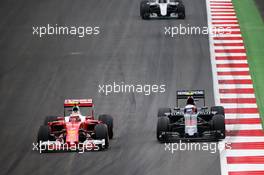 Kimi Raikkonen (FIN) Ferrari SF16-H and Jenson Button (GBR) McLaren MP4-31. 03.07.2016. Formula 1 World Championship, Rd 9, Austrian Grand Prix, Spielberg, Austria, Race Day.