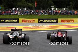 Carlos Sainz Jr (ESP) Scuderia Toro Rosso STR11 and Sergio Perez (MEX) Sahara Force India F1 VJM09 battle for position. 03.07.2016. Formula 1 World Championship, Rd 9, Austrian Grand Prix, Spielberg, Austria, Race Day.