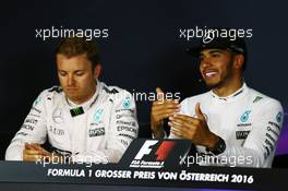 (L to R): Nico Rosberg (GER) Mercedes AMG F1 and team mate Lewis Hamilton (GBR) Mercedes AMG F1 in the post qualifying FIA Press Conference. 02.07.2016. Formula 1 World Championship, Rd 9, Austrian Grand Prix, Spielberg, Austria, Qualifying Day.