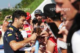 Daniel Ricciardo (AUS) Red Bull Racing signs autographs for the fans. 02.07.2016. Formula 1 World Championship, Rd 9, Austrian Grand Prix, Spielberg, Austria, Qualifying Day.