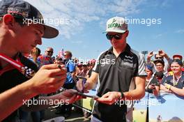 Nico Hulkenberg (GER) Sahara Force India F1 signs autographs for the fans. 02.07.2016. Formula 1 World Championship, Rd 9, Austrian Grand Prix, Spielberg, Austria, Qualifying Day.