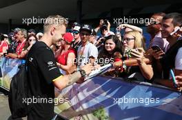 Kevin Magnussen (DEN) Renault Sport F1 Team signs autographs for the fans. 02.07.2016. Formula 1 World Championship, Rd 9, Austrian Grand Prix, Spielberg, Austria, Qualifying Day.