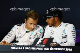 (L to R): Nico Rosberg (GER) Mercedes AMG F1 and team mate Lewis Hamilton (GBR) Mercedes AMG F1 in the post qualifying FIA Press Conference. 02.07.2016. Formula 1 World Championship, Rd 9, Austrian Grand Prix, Spielberg, Austria, Qualifying Day.