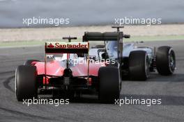 Lewis Hamilton (GBR) Mercedes AMG F1 W07 Hybrid leads Sebastian Vettel (GER)  Ferrari SF16-H. 22.02.2016. Formula One Testing, Day One, Barcelona, Spain. Monday.