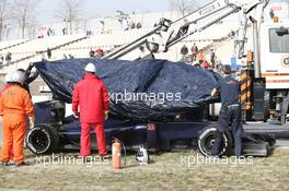 The Scuderia Toro Rosso STR11 of Max Verstappen (NLD) Scuderia Toro Rosso is recovered back to the pits on the back of a truck. 23.02.2016. Formula One Testing, Day Two, Barcelona, Spain. Tuesday.