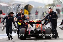 Daniil Kvyat (RUS) Red Bull Racing RB12 is pushed back in the pits. 03.03.2016. Formula One Testing, Day Three, Barcelona, Spain. Thursday.