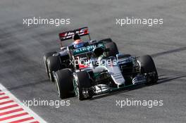 Nico Rosberg (GER) Mercedes AMG F1 W07 Hybrid leads Romain Grosjean (FRA) Haas F1 Team VF-16. 03.03.2016. Formula One Testing, Day Three, Barcelona, Spain. Thursday.