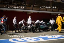 Lewis Hamilton (GBR) Mercedes AMG F1 W07 Hybrid is pushed back in the pits after stopping in the pit lane. 01.03.2016. Formula One Testing, Day One, Barcelona, Spain. Tuesday.