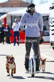 Lewis Hamilton (GBR) Mercedes AMG F1 on a hoverboard in the paddock with his dogs Roscoe and Coco. 01.03.2016. Formula One Testing, Day One, Barcelona, Spain. Tuesday.