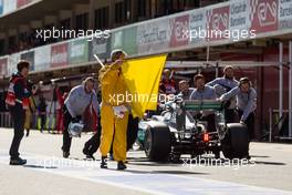 Lewis Hamilton (GBR) Mercedes AMG F1 W07 Hybrid is pushed back in the pits after stopping in the pit lane. 01.03.2016. Formula One Testing, Day One, Barcelona, Spain. Tuesday.