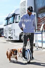 Lewis Hamilton (GBR) Mercedes AMG F1 on a hoverboard in the paddock with his dogs Roscoe and Coco. 01.03.2016. Formula One Testing, Day One, Barcelona, Spain. Tuesday.