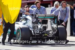 Lewis Hamilton (GBR) Mercedes AMG F1 W07 Hybrid is pushed back in the pits after stopping in the pit lane. 01.03.2016. Formula One Testing, Day One, Barcelona, Spain. Tuesday.