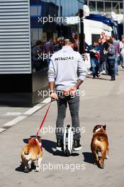 Lewis Hamilton (GBR) Mercedes AMG F1 on a hoverboard in the paddock with his dogs Roscoe and Coco. 01.03.2016. Formula One Testing, Day One, Barcelona, Spain. Tuesday.