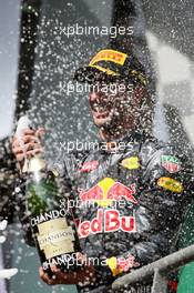 Daniel Ricciardo (AUS) Red Bull Racing celebrates his second position with the champagne on the podium. 28.08.2016. Formula 1 World Championship, Rd 13, Belgian Grand Prix, Spa Francorchamps, Belgium, Race Day.