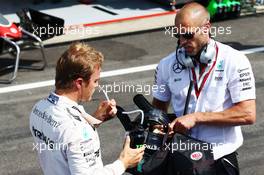 Nico Rosberg (GER) Mercedes AMG F1 with Daniel Schloesser (GER) Mercedes AMG F1 Physio in the pits as the race is stopped. 28.08.2016. Formula 1 World Championship, Rd 13, Belgian Grand Prix, Spa Francorchamps, Belgium, Race Day.