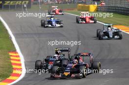 Daniil Kvyat (RUS) Scuderia Toro Rosso STR11 and Jenson Button (GBR) McLaren MP4-31 battle for position. 28.08.2016. Formula 1 World Championship, Rd 13, Belgian Grand Prix, Spa Francorchamps, Belgium, Race Day.