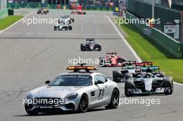 Nico Rosberg (GER) Mercedes AMG F1 W07 Hybrid leads behind the FIA Safety Car. 28.08.2016. Formula 1 World Championship, Rd 13, Belgian Grand Prix, Spa Francorchamps, Belgium, Race Day.