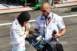 Nico Rosberg (GER) Mercedes AMG F1 with Daniel Schloesser (GER) Mercedes AMG F1 Physio in the pits as the race is stopped. 28.08.2016. Formula 1 World Championship, Rd 13, Belgian Grand Prix, Spa Francorchamps, Belgium, Race Day.