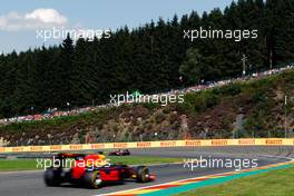 Daniil Kvyat (RUS) Scuderia Toro Rosso STR11 leads Daniel Ricciardo (AUS) Red Bull Racing RB12. 28.08.2016. Formula 1 World Championship, Rd 13, Belgian Grand Prix, Spa Francorchamps, Belgium, Race Day.