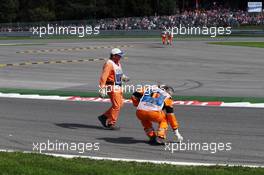 Marshals clear debris from the circuit. 28.08.2016. Formula 1 World Championship, Rd 13, Belgian Grand Prix, Spa Francorchamps, Belgium, Race Day.