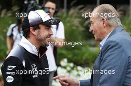 (L to R): Fernando Alonso (ESP) McLaren with Former Spanish King Juan Carlos. 01.04.2016. Formula 1 World Championship, Rd 2, Bahrain Grand Prix, Sakhir, Bahrain, Practice Day