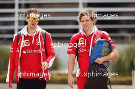 Sebastian Vettel (GER) Ferrari with Antti Kontsas (FIN) Personal Trainer. 01.04.2016. Formula 1 World Championship, Rd 2, Bahrain Grand Prix, Sakhir, Bahrain, Practice Day