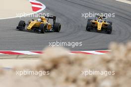 Kevin Magnussen (DEN) Renault Sport F1 Team RS16 and team mate Jolyon Palmer (GBR) Renault Sport F1 Team RS16. 01.04.2016. Formula 1 World Championship, Rd 2, Bahrain Grand Prix, Sakhir, Bahrain, Practice Day