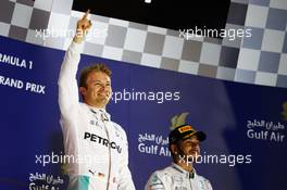 (L to R): Race winner Nico Rosberg (GER) Mercedes AMG F1 celebrates on the podium alongside third placed team mate Lewis Hamilton (GBR) Mercedes AMG F1. 03.04.2016. Formula 1 World Championship, Rd 2, Bahrain Grand Prix, Sakhir, Bahrain, Race Day.