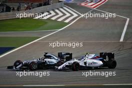 Lewis Hamilton (GBR) Mercedes AMG F1 W07 Hybrid and Valtteri Bottas (FIN) Williams FW38 battle for position. 03.04.2016. Formula 1 World Championship, Rd 2, Bahrain Grand Prix, Sakhir, Bahrain, Race Day.