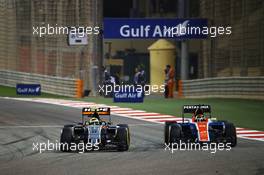 (L to R): Sergio Perez (MEX) Sahara Force India F1 VJM09 and Pascal Wehrlein (GER) Manor Racing MRT05 battle for position. 03.04.2016. Formula 1 World Championship, Rd 2, Bahrain Grand Prix, Sakhir, Bahrain, Race Day.