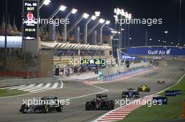 Nico Rosberg (GER) Mercedes AMG F1 W07 Hybrid laps Stoffel Vandoorne (BEL) McLaren MP4-31. 03.04.2016. Formula 1 World Championship, Rd 2, Bahrain Grand Prix, Sakhir, Bahrain, Race Day.