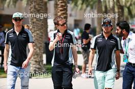 (L to R): Nico Hulkenberg (GER) Sahara Force India F1 with Will Hings (GBR) Sahara Force India F1 Press Officer and Sergio Perez (MEX) Sahara Force India F1. 02.04.2016. Formula 1 World Championship, Rd 2, Bahrain Grand Prix, Sakhir, Bahrain, Qualifying Day.