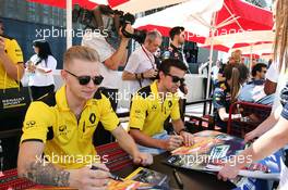 (L to R): Kevin Magnussen (DEN) Renault Sport F1 Team and team mate Jolyon Palmer (GBR) Renault Sport F1 Team sign autographs for the fans. 02.04.2016. Formula 1 World Championship, Rd 2, Bahrain Grand Prix, Sakhir, Bahrain, Qualifying Day.