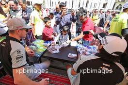 (L to R): Nico Hulkenberg (GER) Sahara Force India F1 and team mate Sergio Perez (MEX) Sahara Force India F1 sign autographs for the fans. 02.04.2016. Formula 1 World Championship, Rd 2, Bahrain Grand Prix, Sakhir, Bahrain, Qualifying Day.