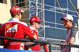(L to R): Sebastian Vettel (GER) Ferrari with Kimi Raikkonen (FIN) Ferrari and egyp on the drivers parade. 03.04.2016. Formula 1 World Championship, Rd 2, Bahrain Grand Prix, Sakhir, Bahrain, Race Day.