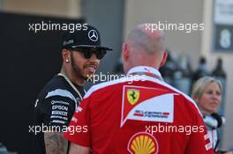 (L to R): Lewis Hamilton (GBR) Mercedes AMG F1 with Jock Clear (GBR) Ferrari Engineering Director. 03.04.2016. Formula 1 World Championship, Rd 2, Bahrain Grand Prix, Sakhir, Bahrain, Race Day.